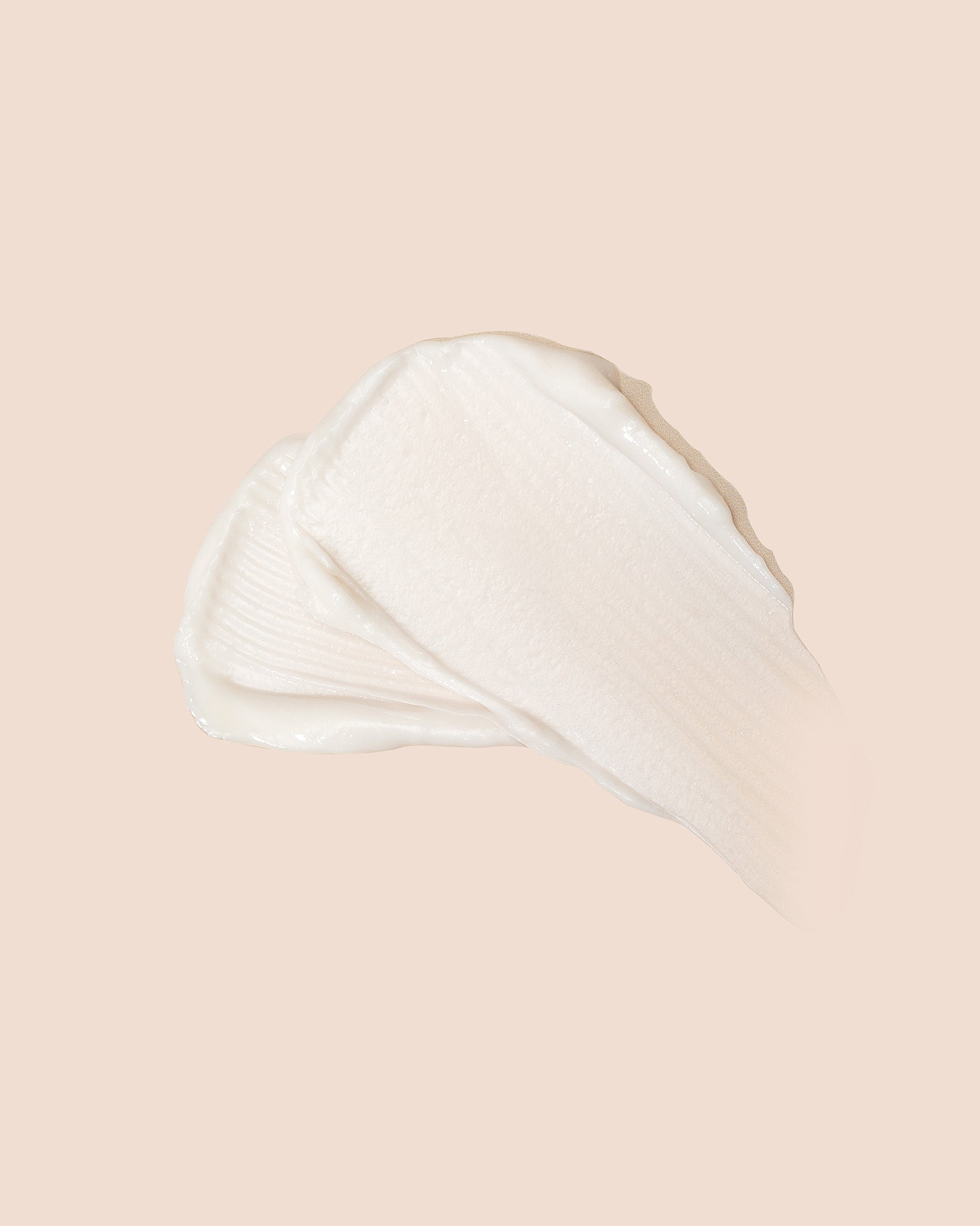 As I Am Hydration Elation Intensive Conditioner tekstur. Nærbillede af cremet, hvid balsam.