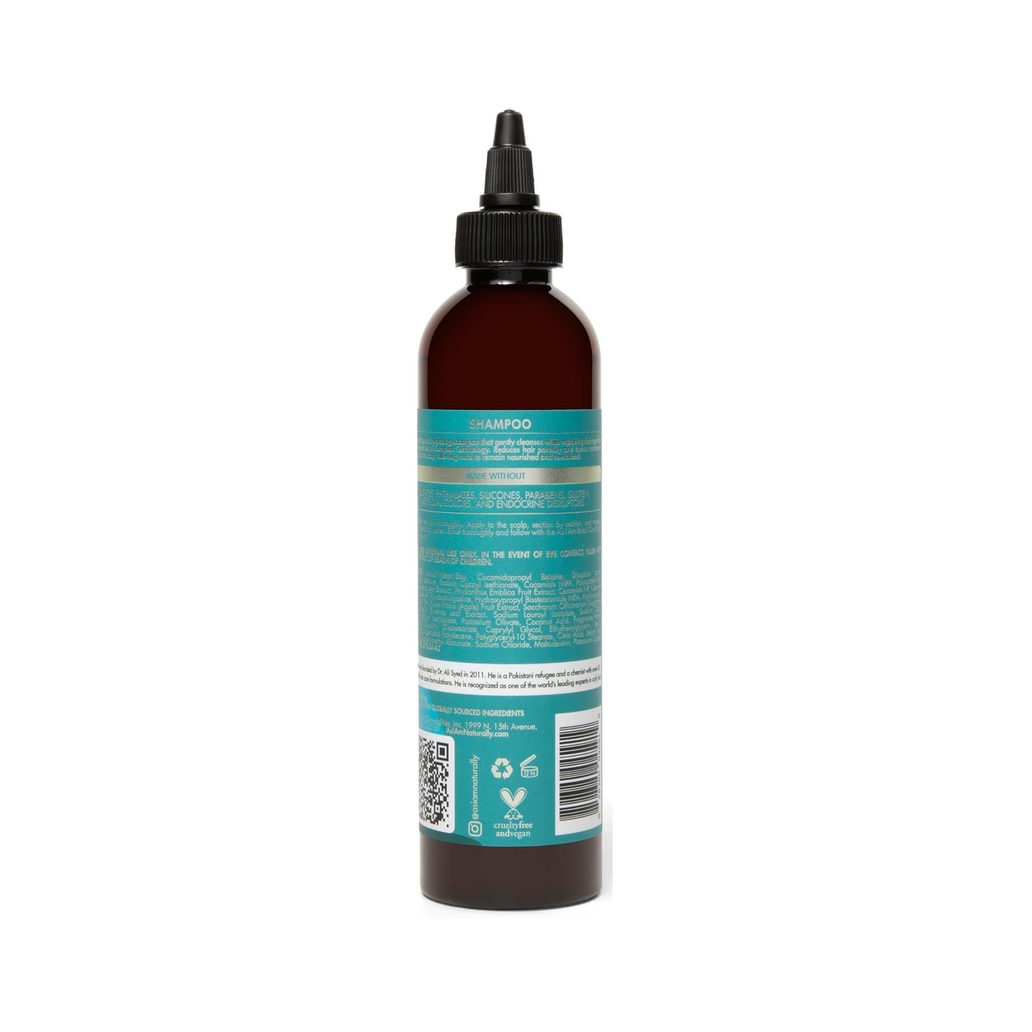 Brun plastikflaske shampoo med sort dyseprop og turkis etiket med ingrediensliste på hvid baggrund.