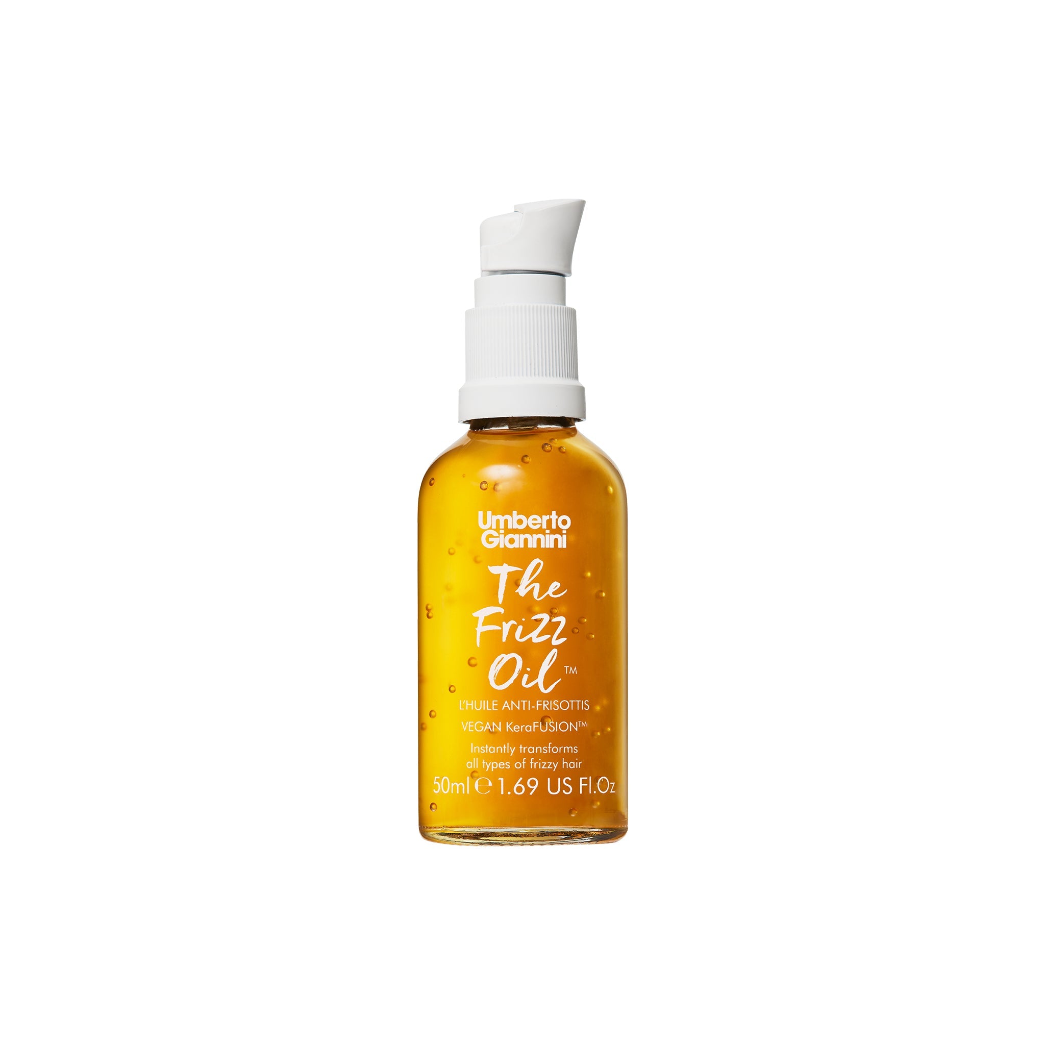 Gylden flaske med Umberto Giannini The Frizz Oil mod kruset hår med pumpe og små luftbobler i olien.