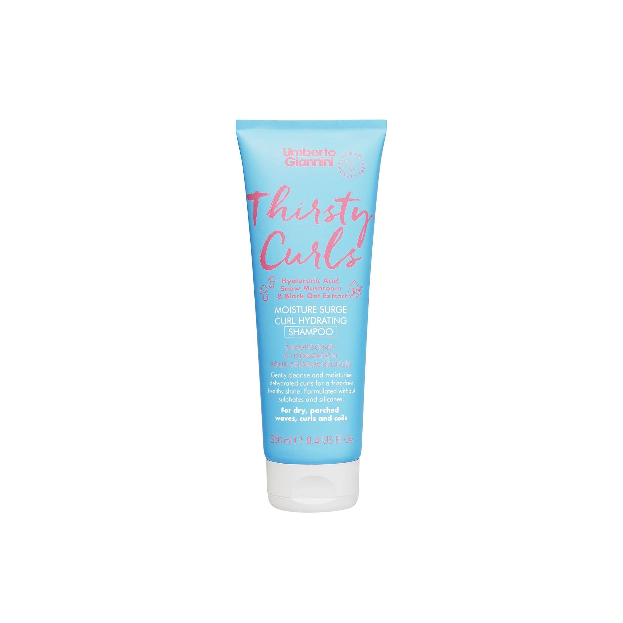 Umberto Giannini Thirsty Curls Moisture Surge Shampoo i blå tube med lyserød tekst, til tørt og kruset krøllet hår.